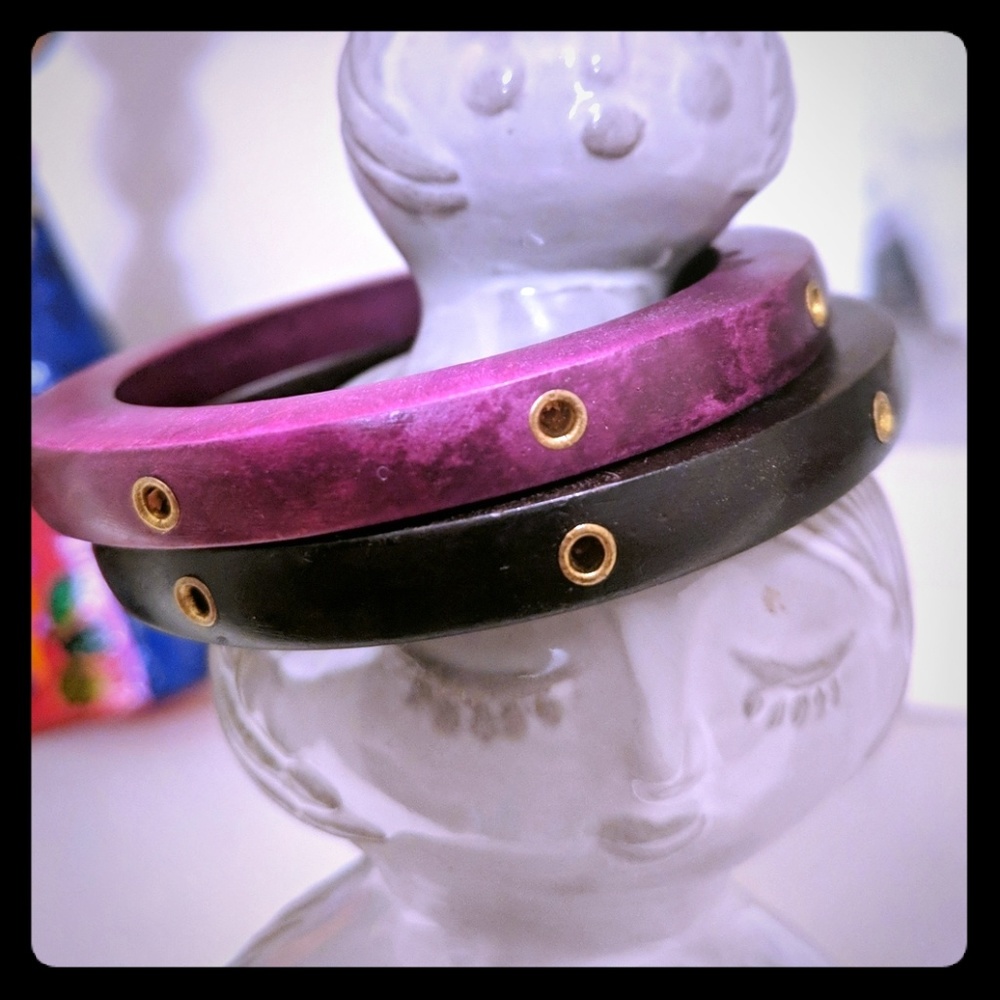 Two wooden bangles with golden details